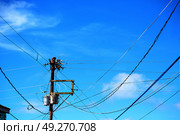 blur  in  philippines   a electric pole with transformer and wire  the cloudy sky. Стоковое фото, агентство Ingram Publishing / Фотобанк Лори