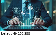 A person in a business suit working on a laptop with virtual icons related to key performance indicators (KPI), displaying business dashboard. Стоковое AI-видео, аниматор Sergey Grishin / Фотобанк Лори