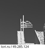 waving greece flag  in the   blue sky and      flagpole. Стоковое фото, агентство Ingram Publishing / Фотобанк Лори