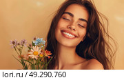 A joyful woman with freckles and wind-blown hair holds a bouquet, celebrating spring. Стоковое AI-изображение, AI-художник Данила Большаков / Фотобанк Лори