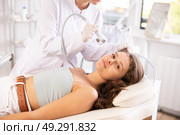 Young girl undergoing facial procedure with atomized nutrients applying to skin. Стоковое фото, фотограф Яков Филимонов / Фотобанк Лори