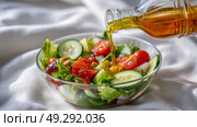 Fresh vegetable salad with olive oil in glass bowl on white background. Стоковое AI-изображение, AI-художник Olga Didraga / Фотобанк Лори