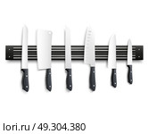 Knives On Magnetic Strip 3D Illustration. Variety of kitchen knives with black handle on magnetic strip on white background 3d vector illustration. Стоковая иллюстрация, агентство Ingram Publishing / Фотобанк Лори