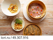 Iberian pork ham with XO sauce and cabbage stew with pork rinds. Стоковое фото, агентство Ingram Publishing / Фотобанк Лори