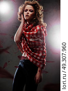 Elegant, sensual woman wearing a checked shirt. Стоковое фото, агентство Ingram Publishing / Фотобанк Лори