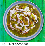 Chilaquiles verdes green recipe from Mexico. Стоковое фото, агентство Ingram Publishing / Фотобанк Лори