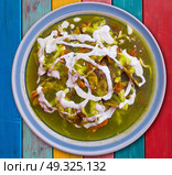 Chilaquiles verdes green recipe from Mexico. Стоковое фото, агентство Ingram Publishing / Фотобанк Лори