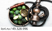 oriental nargile with feijoa. hookah with a tobacco flavor of a feijoa. Стоковое фото, агентство Ingram Publishing / Фотобанк Лори