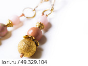 gold earrings with pink semipreciouses. nephritis and variscite. Стоковое фото, агентство Ingram Publishing / Фотобанк Лори
