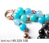 jewerly bracelet  with chalcedony and obsidian around white background. Стоковое фото, агентство Ingram Publishing / Фотобанк Лори