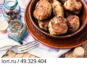 tasty homemade cutlets. Homemade cutlets in clay ware on a plate.Ukrainian food. Стоковое фото, агентство Ingram Publishing / Фотобанк Лори