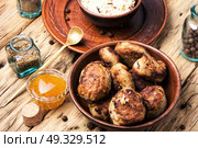 meat homemade cutlets. Homemade cutlets in clay ware on plate.Ukrainian home food. Стоковое фото, агентство Ingram Publishing / Фотобанк Лори