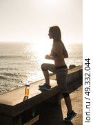 Fitness woman doing exercices on summer sunset. Стоковое фото, агентство Ingram Publishing / Фотобанк Лори