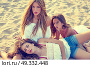 Best friends teen girls together relaxed on a beach sand at sunset. Стоковое фото, агентство Ingram Publishing / Фотобанк Лори