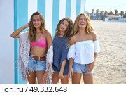 Best friends teen girls group happy in a summer blue stripes background. Стоковое фото, агентство Ingram Publishing / Фотобанк Лори