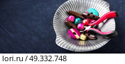 Bright wooden beads. Variety of wooden beads for needlework in a stylish tray. Стоковое фото, агентство Ingram Publishing / Фотобанк Лори
