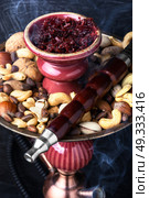 hookah shisha with nut. smoking hookah in Arabic style with the tobacco nut. Стоковое фото, агентство Ingram Publishing / Фотобанк Лори