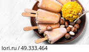 unusual ice cream with pumpkin. extraordinary ice cream with pumpkin taste and hazelnut. Стоковое фото, агентство Ingram Publishing / Фотобанк Лори