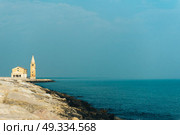 Church of Our Lady of the Angel on the beach of Caorle Italy, Santuario della Madonna dell’Angelo. Стоковое фото, агентство Ingram Publishing / Фотобанк Лори
