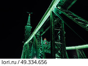 Old Iron Bridge at night in the light of streetlights across the Danube River in Budapest Hungary. Стоковое фото, агентство Ingram Publishing / Фотобанк Лори