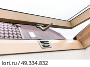 open wooden attic window overlooking the street. Стоковое фото, агентство Ingram Publishing / Фотобанк Лори