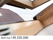 open wooden attic window overlooking the street. Стоковое фото, агентство Ingram Publishing / Фотобанк Лори