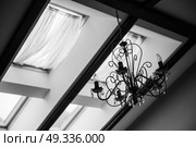 skylights in the roof of the house with a vintage chandelier on the ceiling. Стоковое фото, агентство Ingram Publishing / Фотобанк Лори