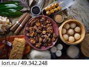 Shiitake rice dumplings steamed pork buns noodles Asian cuisine food mix. Стоковое фото, агентство Ingram Publishing / Фотобанк Лори