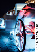 The old square of the night krakow with luminous horse-drawn carriages. Стоковое фото, агентство Ingram Publishing / Фотобанк Лори