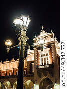 Night old commercial area of Krakow in the lights of street lamps. Old Europe. Стоковое фото, агентство Ingram Publishing / Фотобанк Лори