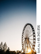 Ferris wheel against the blue sky in the port city Gdynia Poland. Стоковое фото, агентство Ingram Publishing / Фотобанк Лори