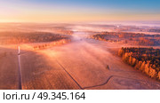 Spring foggy sunrise. Mist over fields. Aerial rural landscape. Sunny morning. Стоковое фото, агентство Ingram Publishing / Фотобанк Лори
