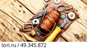 Tools for leather craft. Working tools and cut out pieces of leather. Стоковое фото, агентство Ingram Publishing / Фотобанк Лори