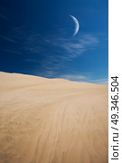 Tourists travel through the dunes in the Atacama Desert. Oasis of Huacachina, Peru, South America. moon shines. Стоковое фото, агентство Ingram Publishing / Фотобанк Лори