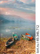 Phewa Lake - the second largest lake in Nepal located in the Pokhara Valley near the town and the mountain Sarangkot. Стоковое фото, агентство Ingram Publishing / Фотобанк Лори