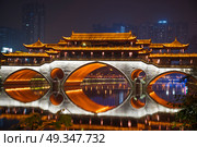Anshun Bridge and the new development in Chengdu in southwest China. Anshun Bridge. Стоковое фото, агентство Ingram Publishing / Фотобанк Лори