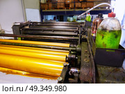 Printer ink machine rotary printing. Printer ink machine rotary printing factory golden printer rollers. Стоковое фото, агентство Ingram Publishing / Фотобанк Лори