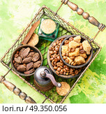 Roasted coffee beans. Coffee beans, cardamom, spices sugary in a stylish basket. Стоковое фото, агентство Ingram Publishing / Фотобанк Лори