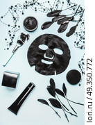 Various cosmetic products with activated charcoal for facial skin care on light background, top view, flat lay. Beauty concept.  Branding mock up. Стоковое фото, агентство Ingram Publishing / Фотобанк Лори