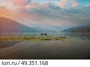 Lake Phewa - at the second largest lake in Nepal located in the Pokhara Valley near Pokhara and Sarangkot mountain. Lake Phewa . Стоковое фото, агентство Ingram Publishing / Фотобанк Лори