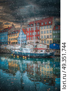 there is snow in the winter. Nyhavn is the old harbor of Copenhagen. Denmark. Nyhavn is the old harbor of Copenhagen. Стоковое фото, агентство Ingram Publishing / Фотобанк Лори