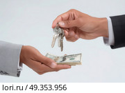 A man is giving keys to a woman in exchange for money. Стоковое AI-изображение, AI-художник Ярославский Максим / Фотобанк Лори