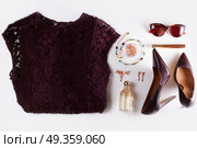 Fashion flat lay scene. Fashion flat lay scene. Dress, hight heel shoes and sunglasses, dressing up for party fashion accessoires. Стоковое фото, агентство Ingram Publishing / Фотобанк Лори
