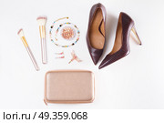 Fashion Christmas flat lay scene. Fashion flat lay scene. Hight heel shoes, bag, dressing up for party fashion accessoires. Стоковое фото, агентство Ingram Publishing / Фотобанк Лори