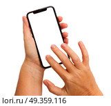 WARSAW, POLAND - DECEMBER 02, 2017: Two hands holding and touching new Iphone X mobile phone over white background. New Iphone X. New Iphone X. Редакционное фото, агентство Ingram Publishing / Фотобанк Лори