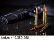 Ammunition cartridges on black background. Ammunition cartridges on black. Стоковое фото, агентство Ingram Publishing / Фотобанк Лори