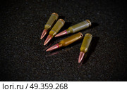 Ammunition cartridges on black background. Ammunition cartridges. Стоковое фото, агентство Ingram Publishing / Фотобанк Лори