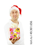 The man presents the Christmas gift isolated. Presentation. Стоковое фото, агентство Ingram Publishing / Фотобанк Лори