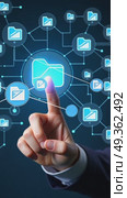 A hand with an index finger pointing at a folder icon on a virtual digital interface with blue and white elements, surrounded by modern futuristic hi-tech business financial interface. Стоковое AI-видео, аниматор Sergey Grishin / Фотобанк Лори