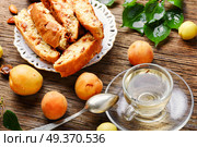 Variety of biscotti - cantucci, cantuccini, kind of biscuit, with the addition of almonds and dried fruits. Italian almond biscotti. Стоковое фото, агентство Ingram Publishing / Фотобанк Лори
